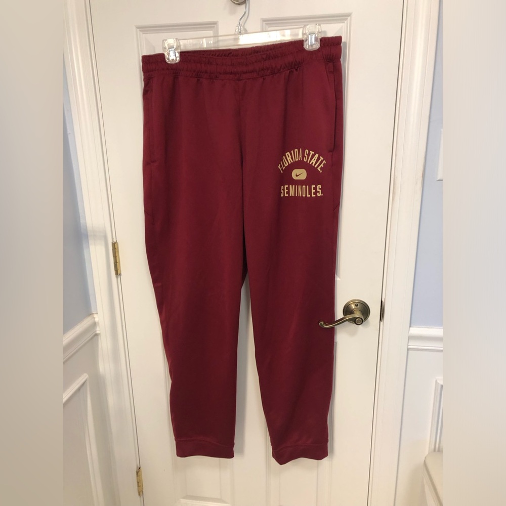 Nike Dri Fit Florida State Seminoles athletic pants. Side pockets. Banded btm